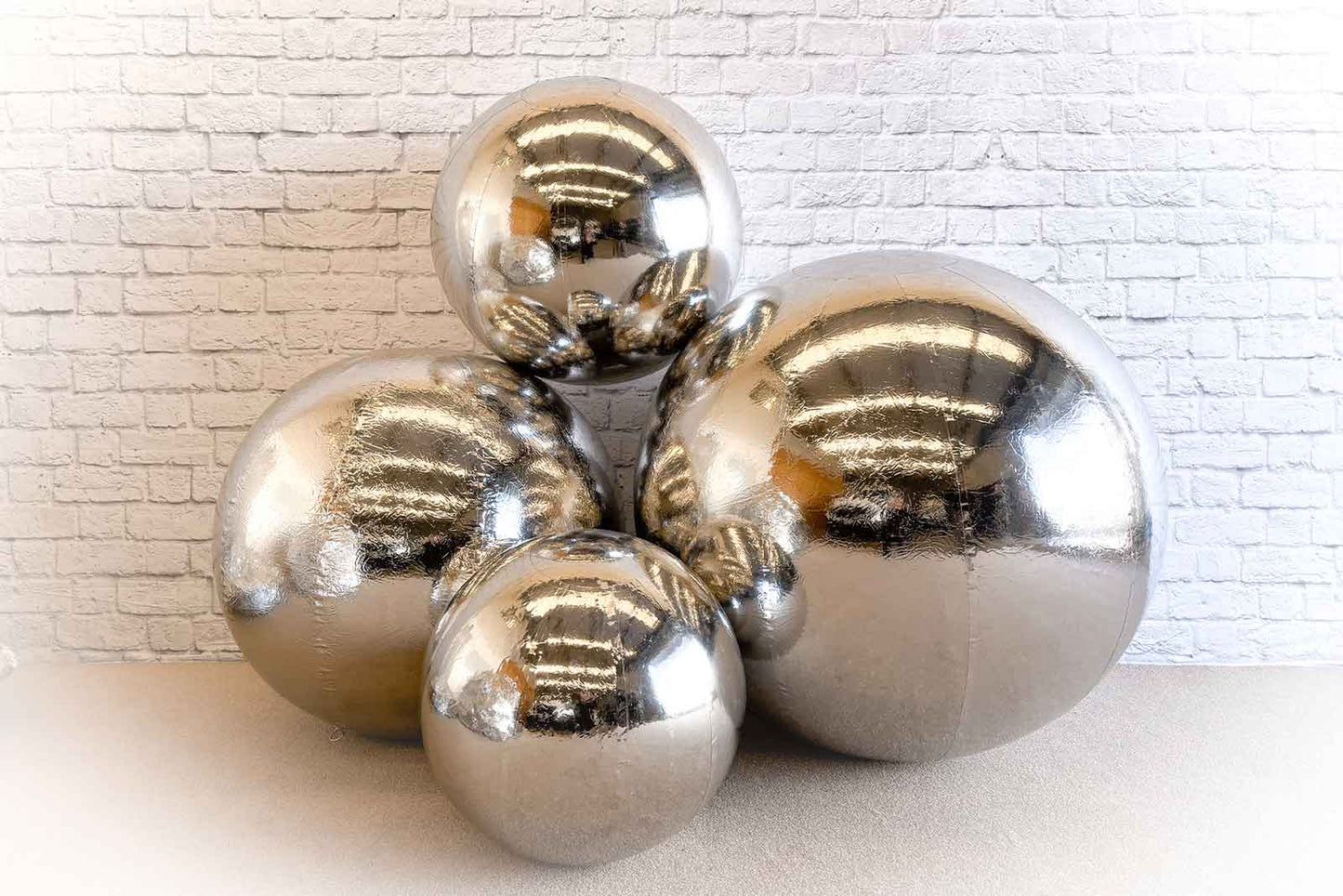 Silver inflatable spheres for weddings, parties, or events