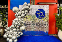 Load image into Gallery viewer, Silver sequin shimmer wall used as a branded corporate backdrop
