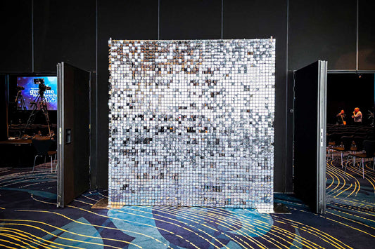 Silver shimmer wall hire adding modern elegance to corporate launches, baby shower,  and activations