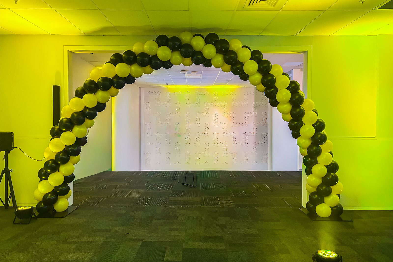 Spiral balloon arch in modern colour pattern for event entrance and backdrop hire in Auckland