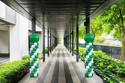 Spiral balloon column with alternating coloured balloons creating a twisting decorative event entrance feature