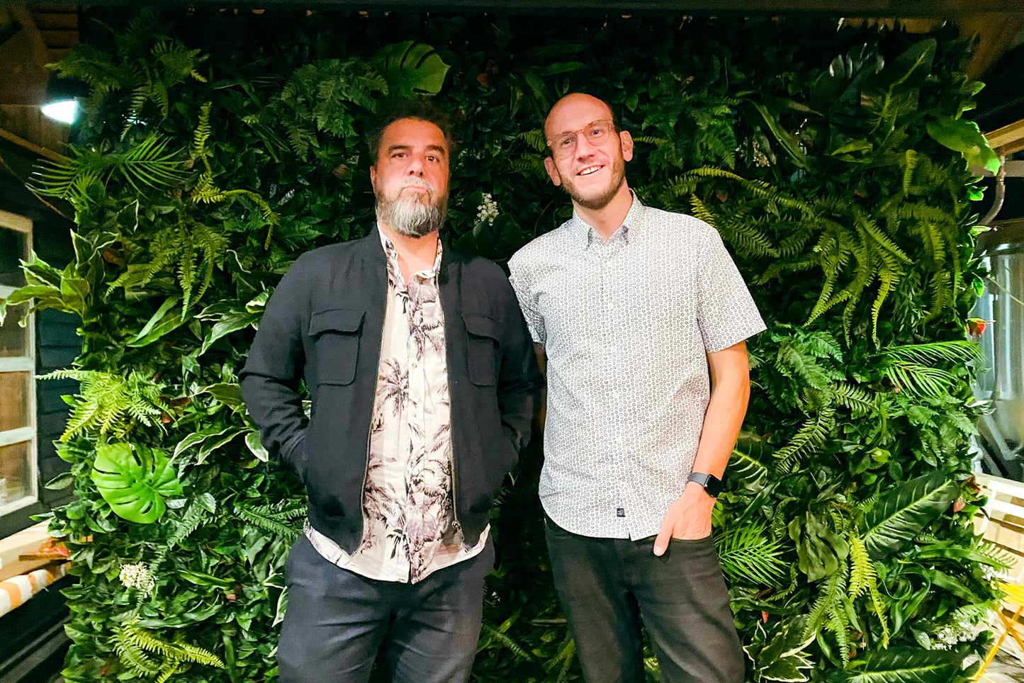 Tropical foliage feature wall creating a lush natural backdrop for event styling and celebrations