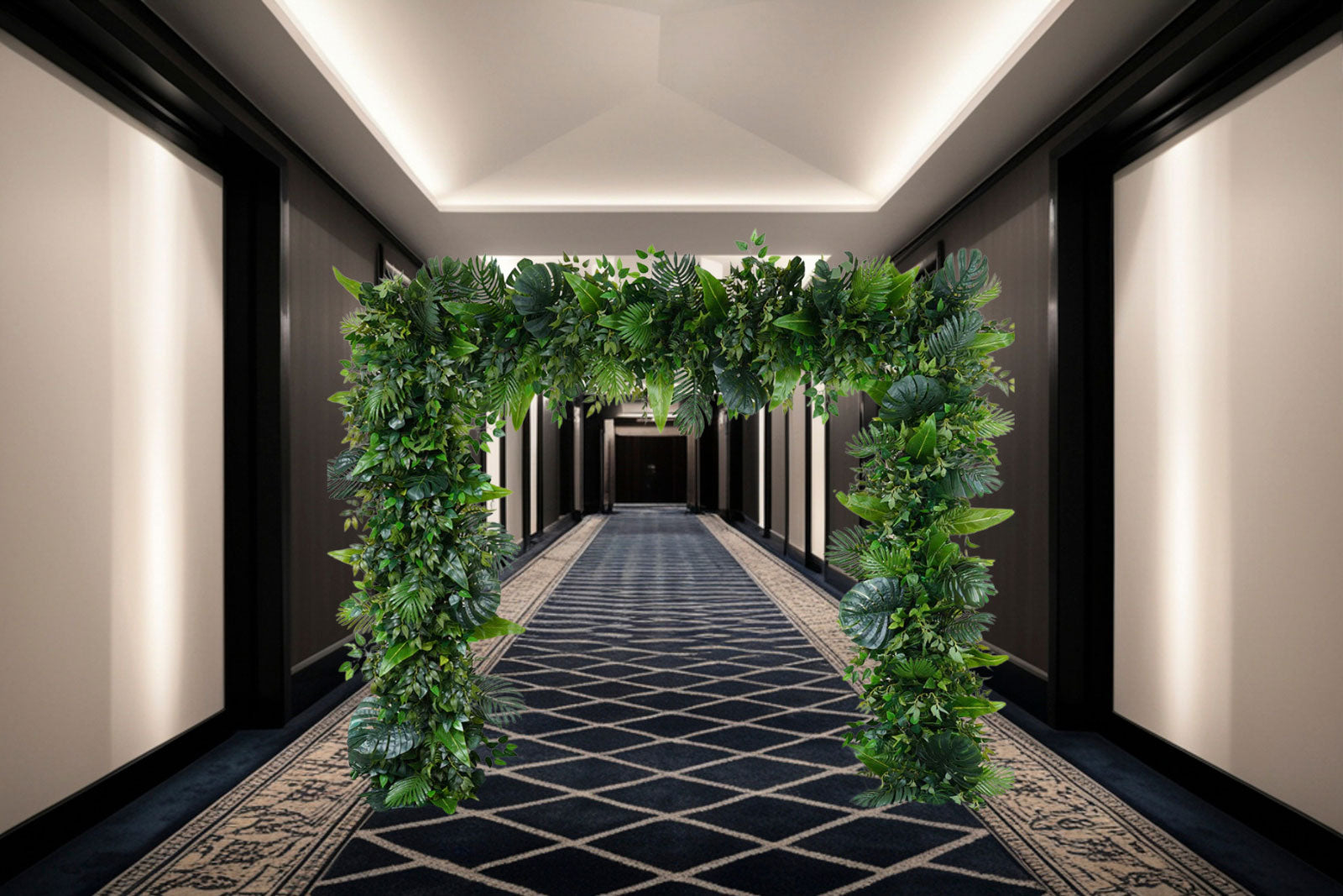 Tropical Oasis Greenery Frame with lush tropical foliage and monstera leaves, designed as a walk-through entrance feature and photo backdrop for weddings, corporate events, and tropical-themed celebrations in Auckland.