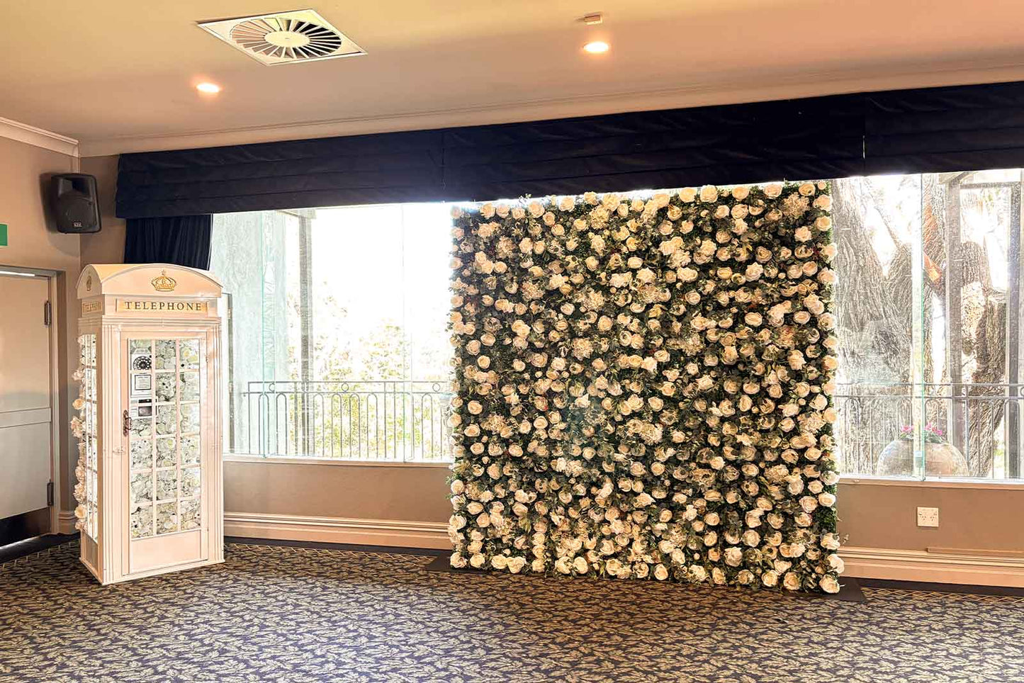 Wedding flower wall backdrop with photo booth for fun guest photos and reception décor