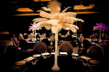 Load image into Gallery viewer, White feather centrepiece adding height and sophistication to a corporate gala dinner table
