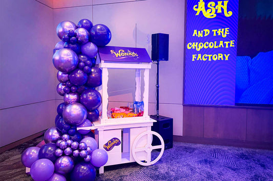 Willy Wonka themed candy cart for hire featuring colourful sweets display, perfect for birthdays, kids parties and themed events in Auckland
