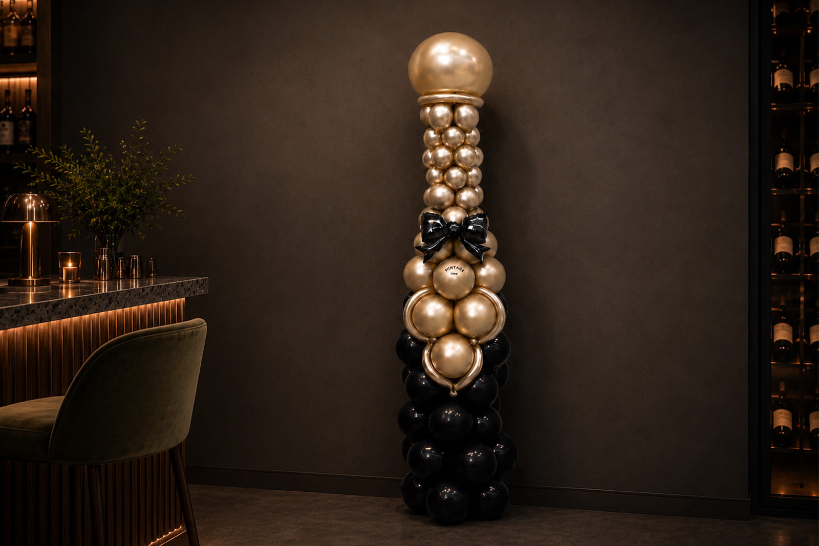 Wine bottle balloon sculpture for corporate event decor in Auckland with custom balloon styling.