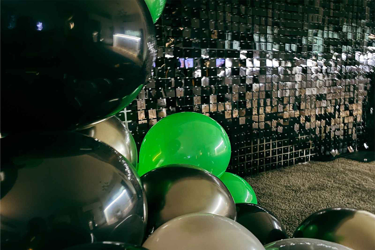 Black shimmer wall backdrop for a birthday celebration in Auckland