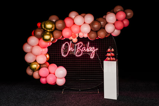 Black mesh circle backdrop with Oh Baby neon sign for baby shower or event décor