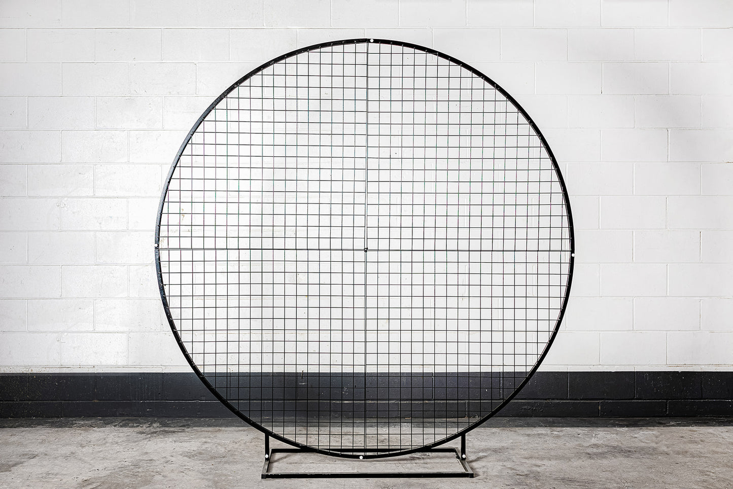 Decorative black mesh circle backdrop for photo displays and celebrations