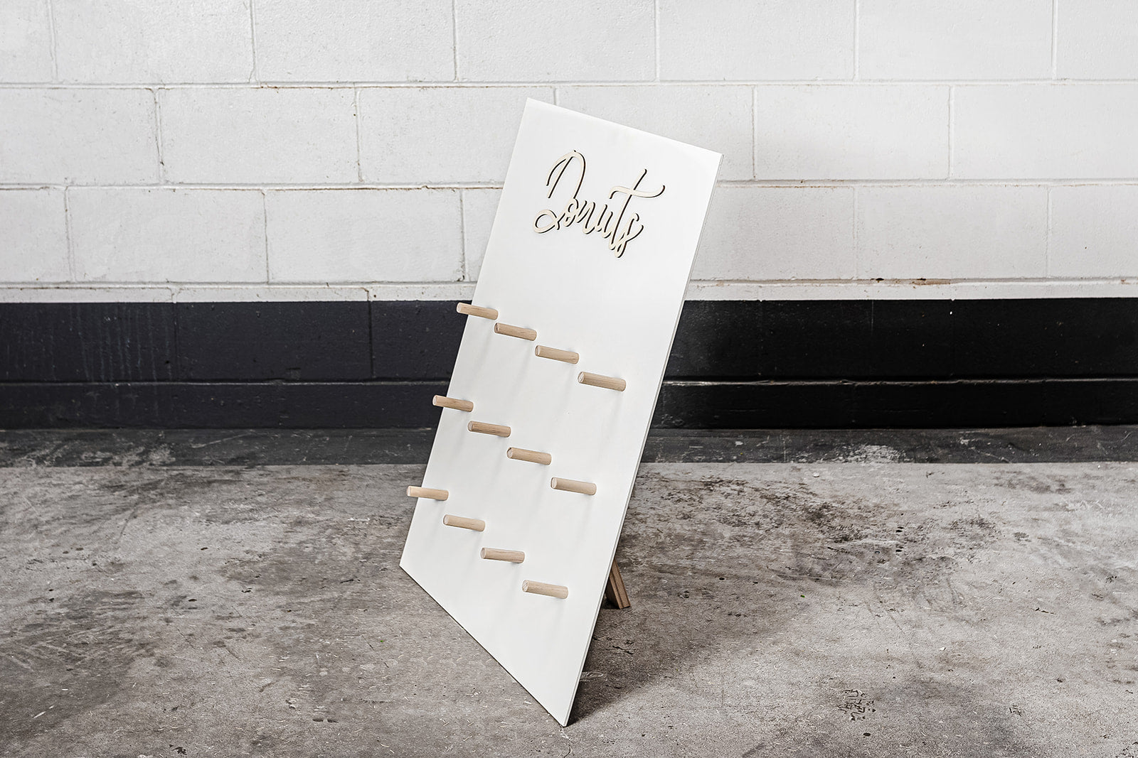 Colourful donut wall hire for weddings, celebrations, and themed event décor