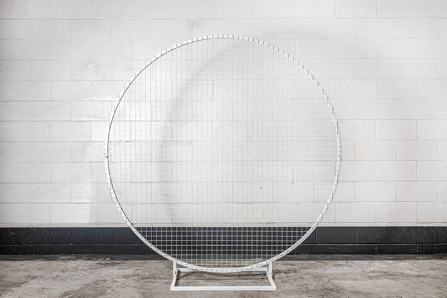 Decorative white mesh circle backdrop for photo opportunities