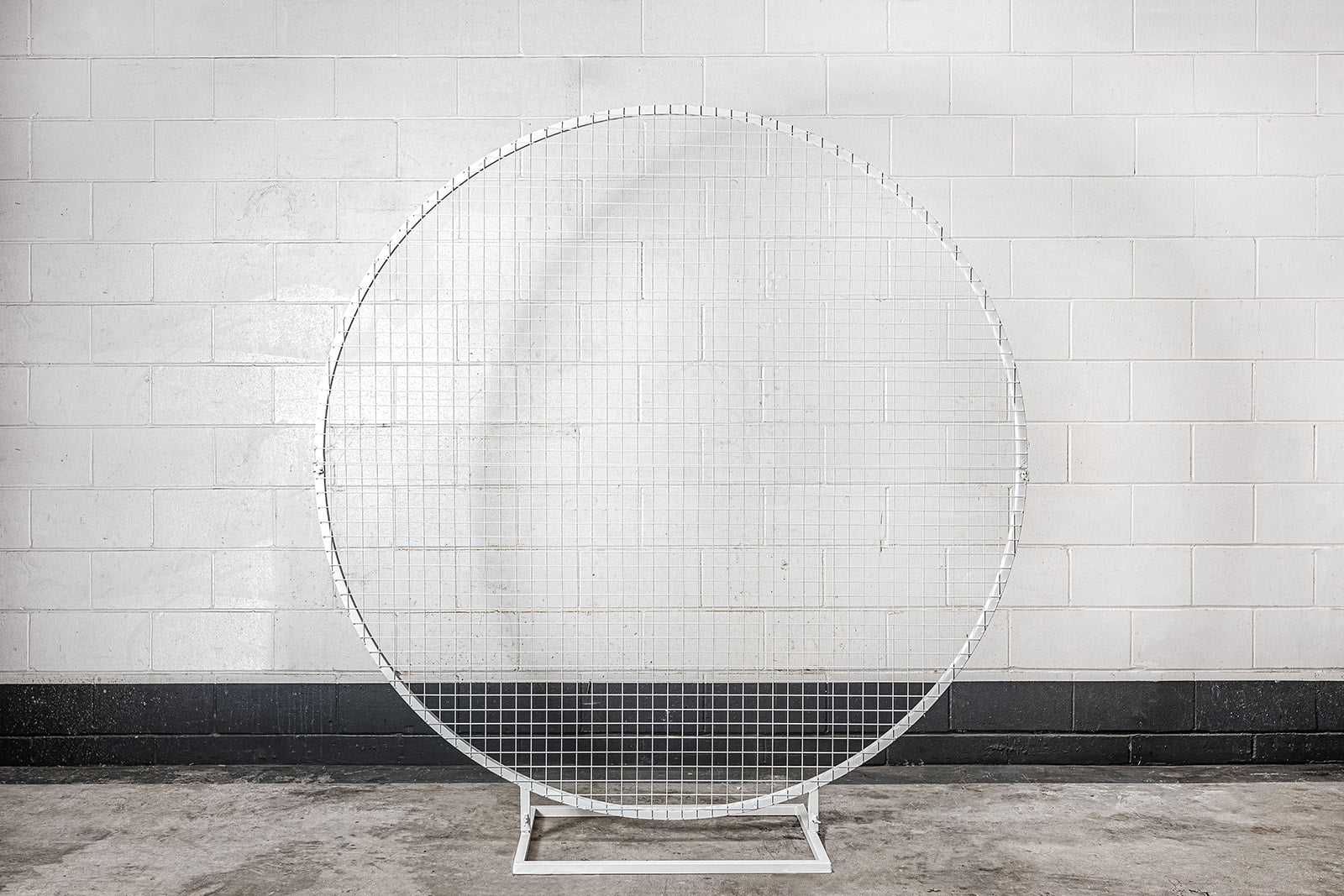 Decorative white mesh circle backdrop for photo opportunities