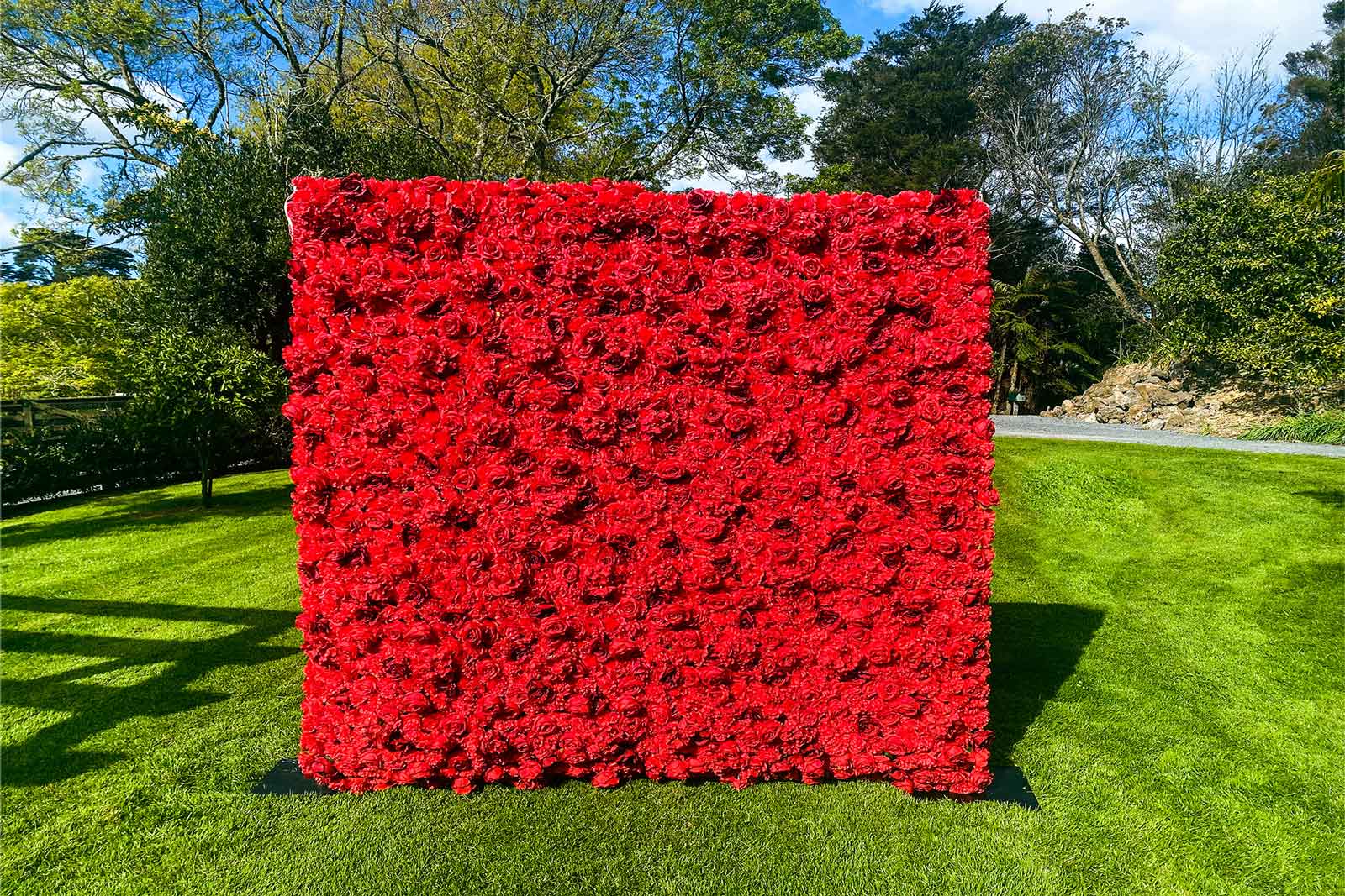 Red flower wall backdrop for weddings, corporate events, parties, and photo booths in Auckland NZ