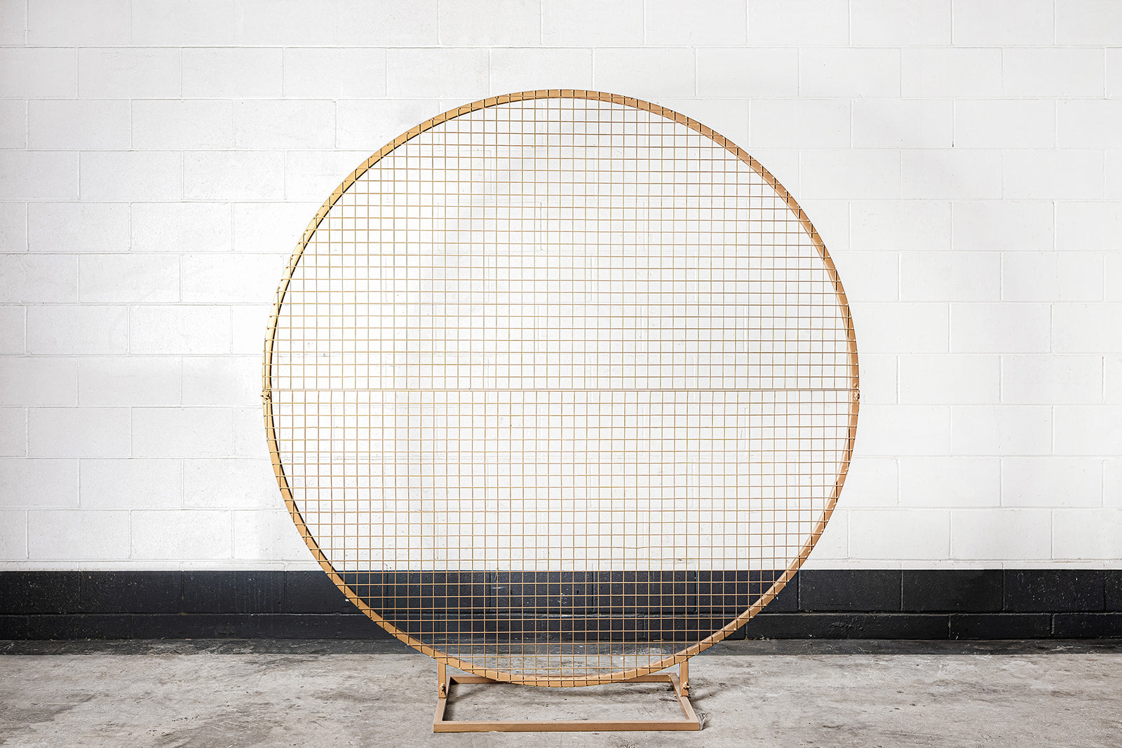 Elegant gold mesh circle backdrop for corporate or social events