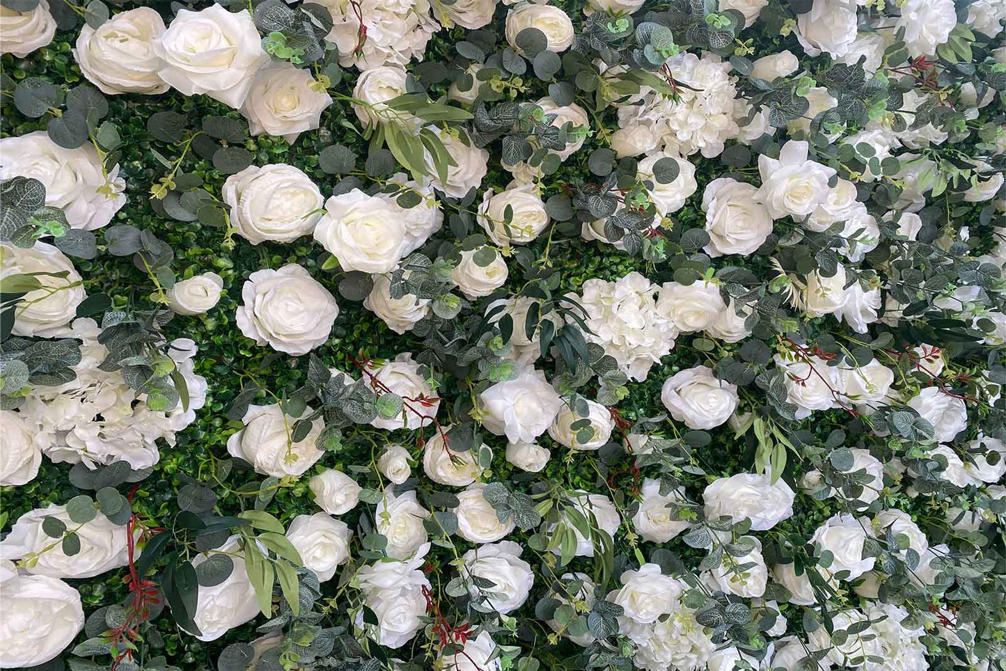 Elegant wedding flower wall backdrop with lush blooms for ceremony and reception décor