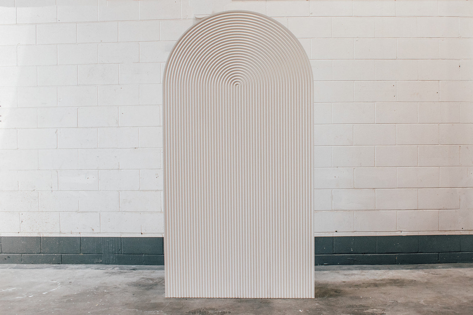 Ribbed arch backdrop hire for weddings, birthdays, and themed event décor