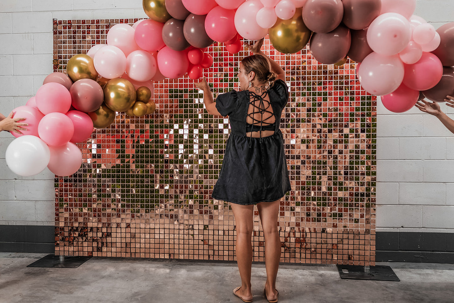 Rose gold shimmer wall hire adding a stylish and polished look to corporate functions