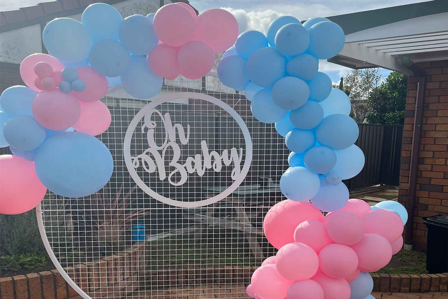 White wooden Oh Baby sign for baby shower décor and events